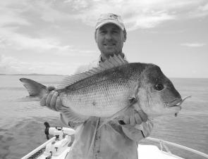Chris Blanch with a lovely snapper caught off Lake Cathie on a Berkley 5” Gulp 